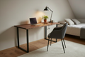 Bespoke live edge walnut desk with black steel frame legs in a bedroom setting